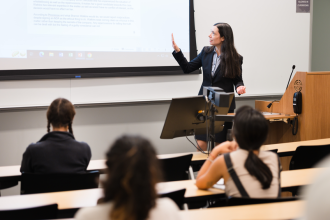 female faculty member teaching a class