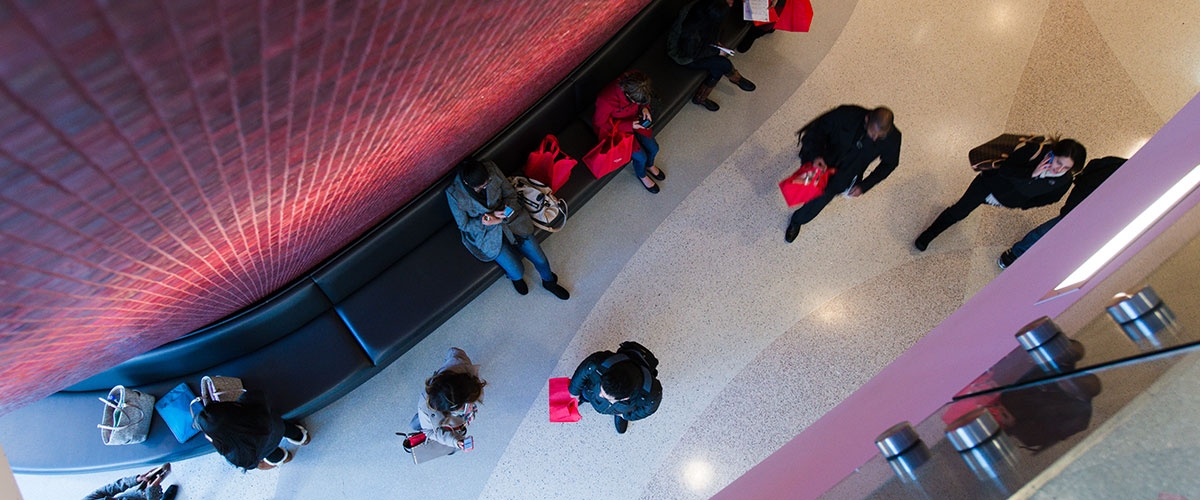 People move through a hallway at RBS newark.