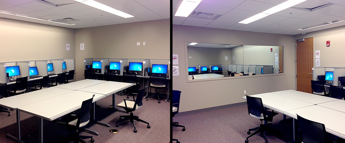 The behavioral lab room is equipped with tables, computers and mirrors.
