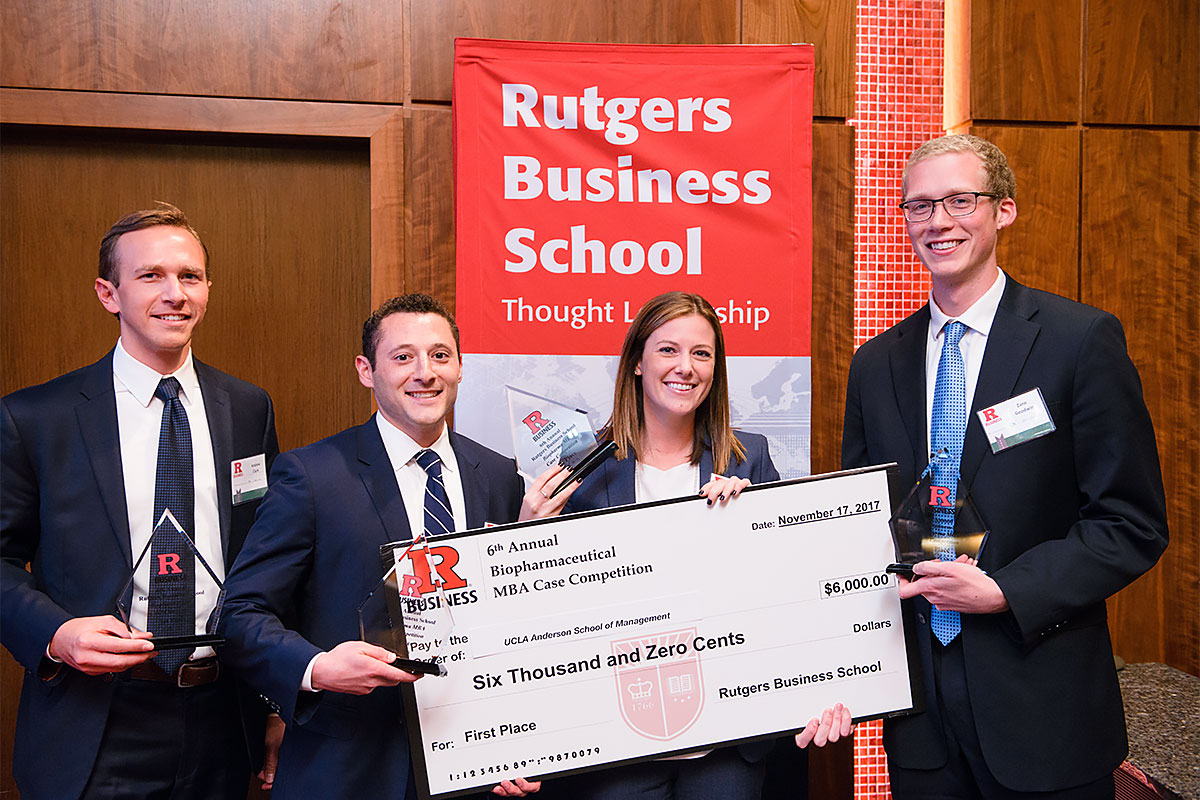 Case competition winner pose with their prize check