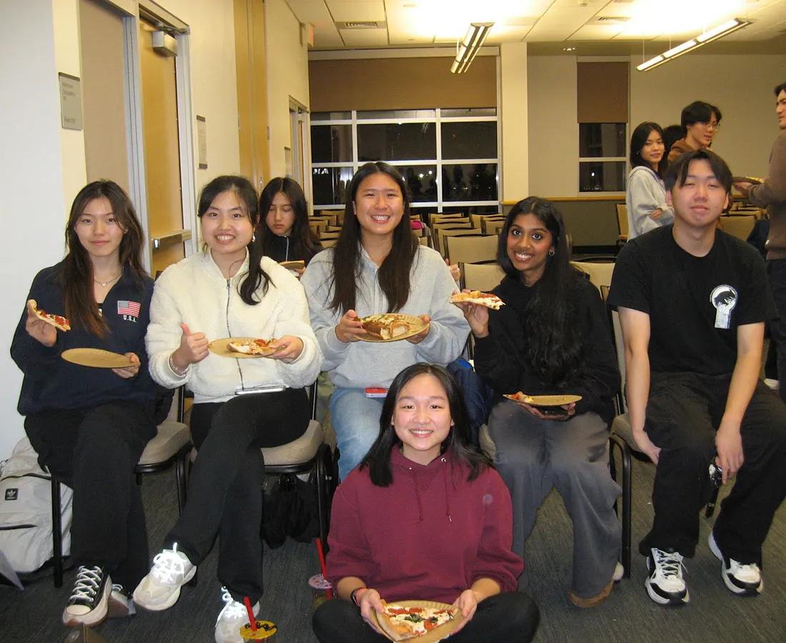 Members posing as a group at an event