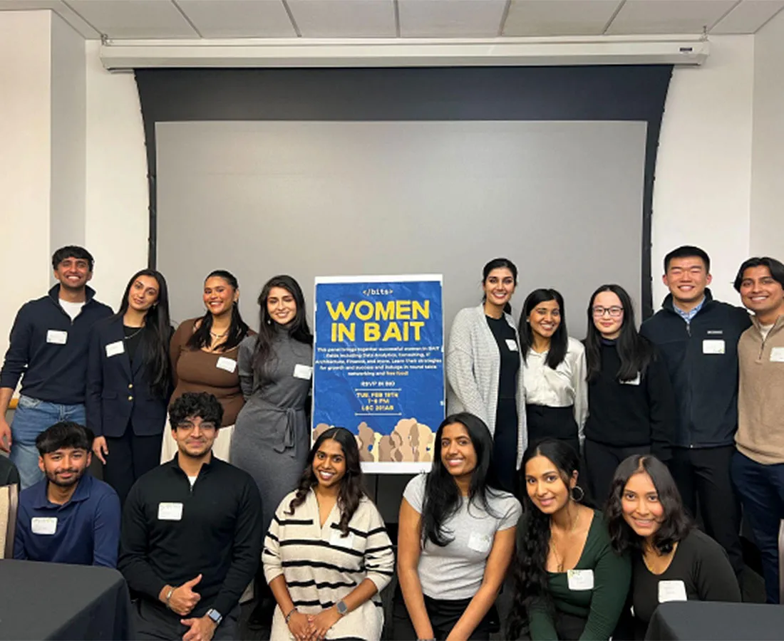Members posing as a group at an event