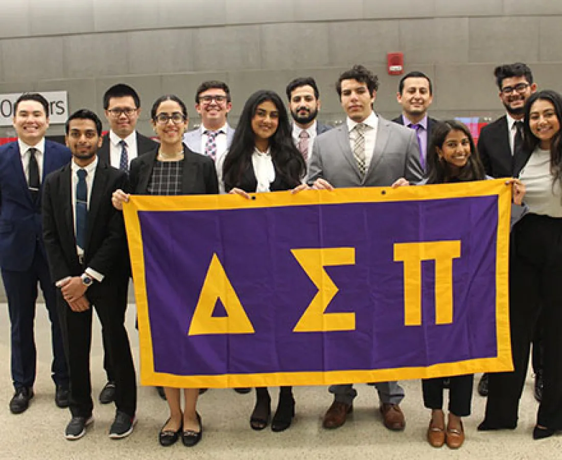 delta sigma members holding club flag