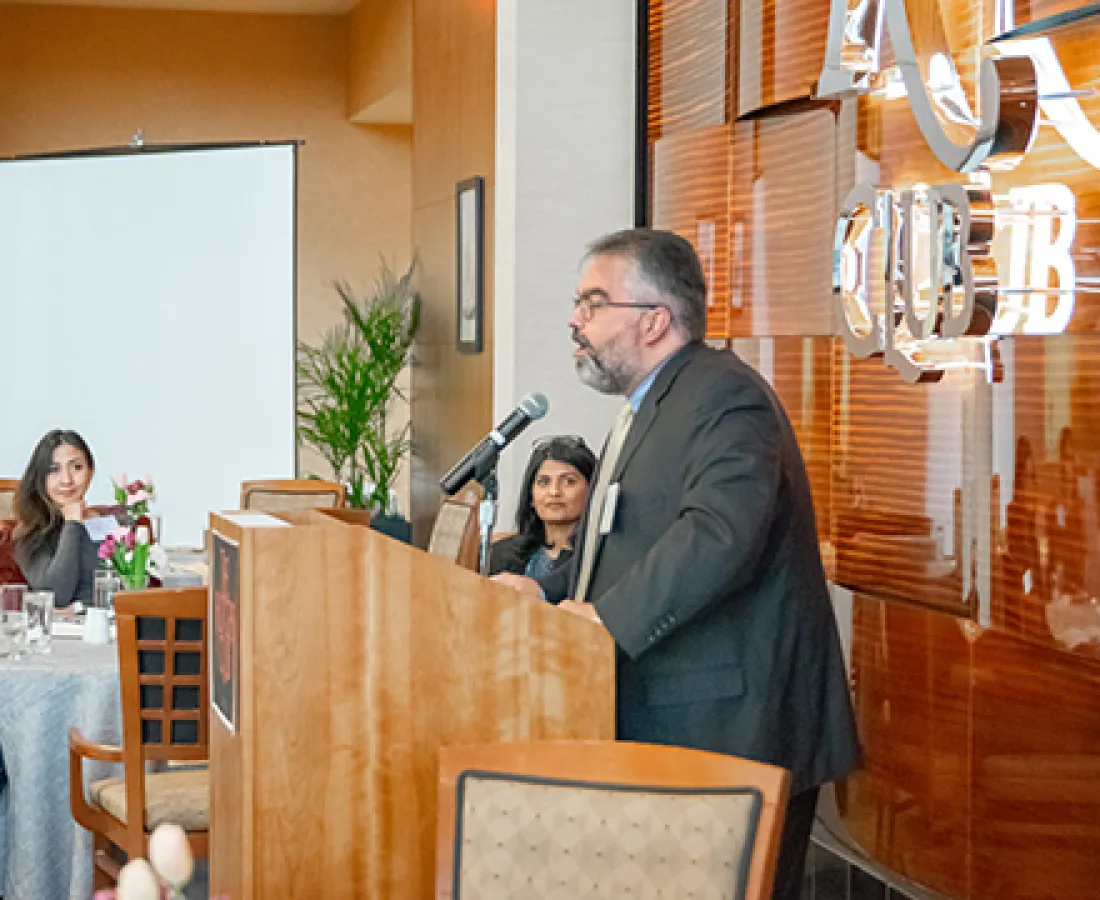 heir mentor giving a speech