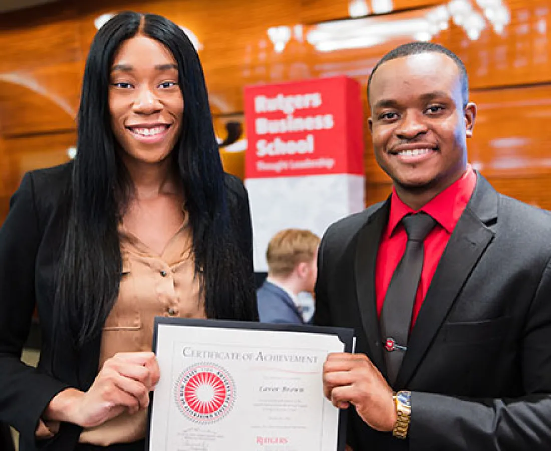 mentor and mentee holding certificate