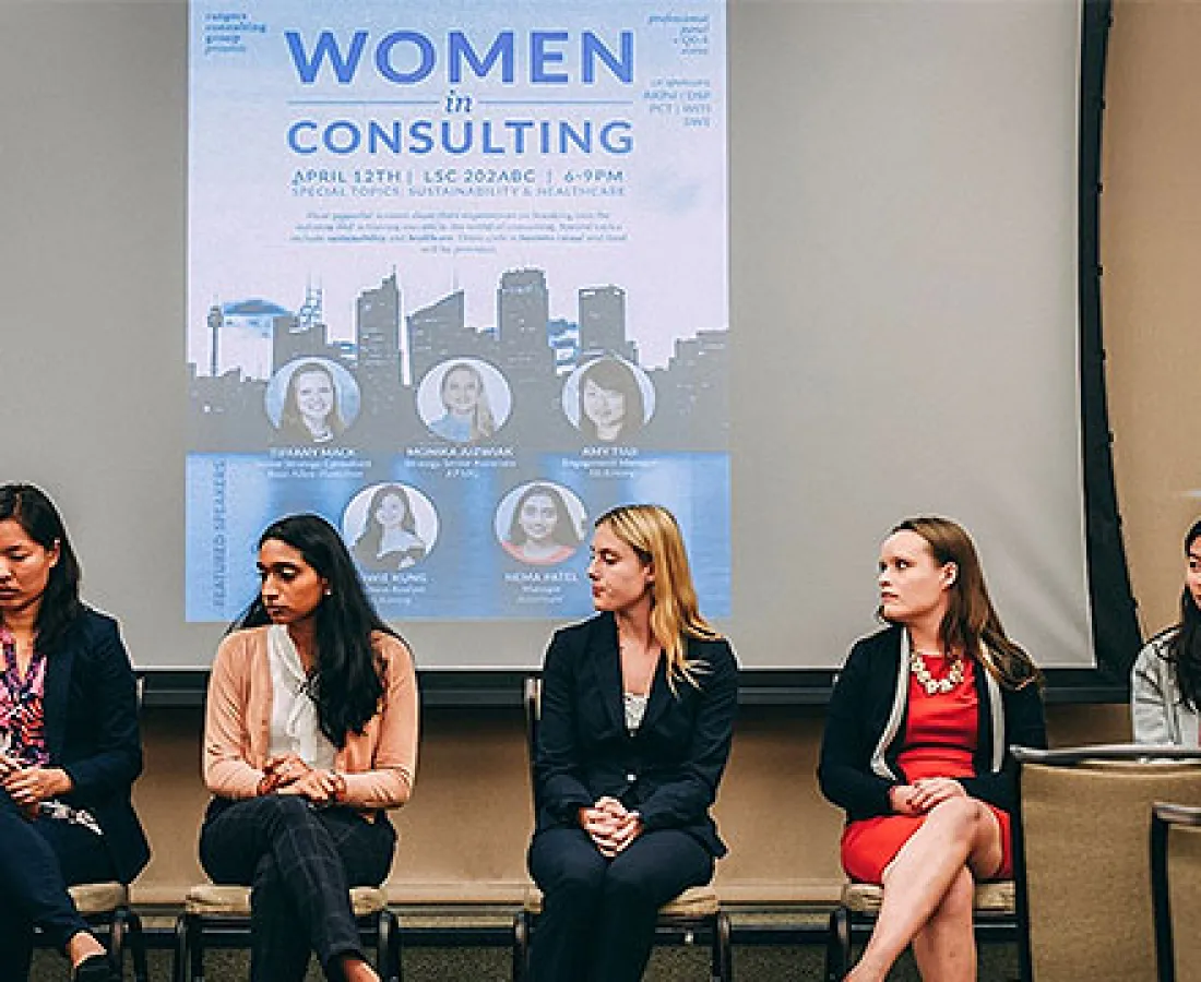 A group of women sitting on a panel for Women in Consulting
