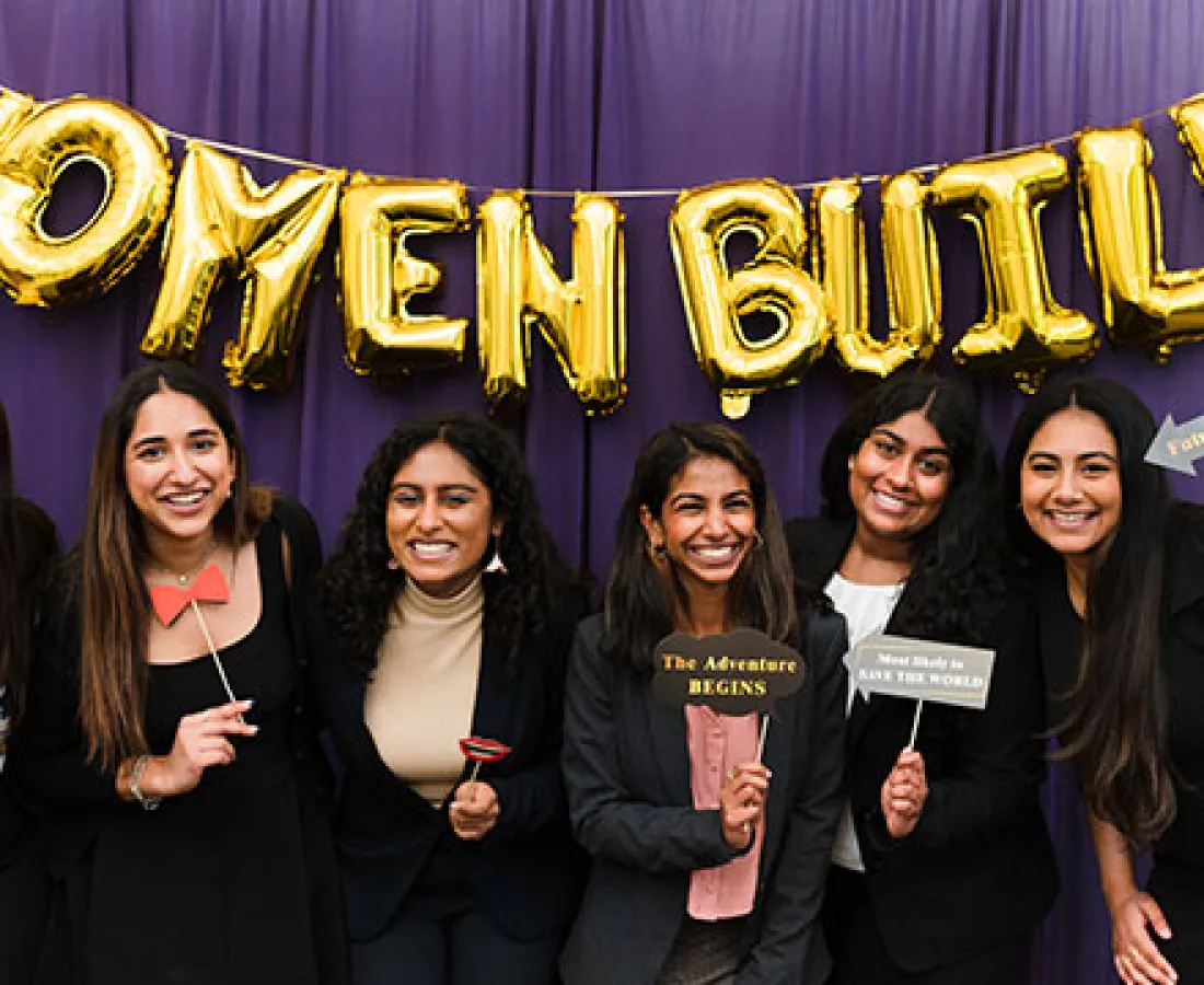 women build members posing