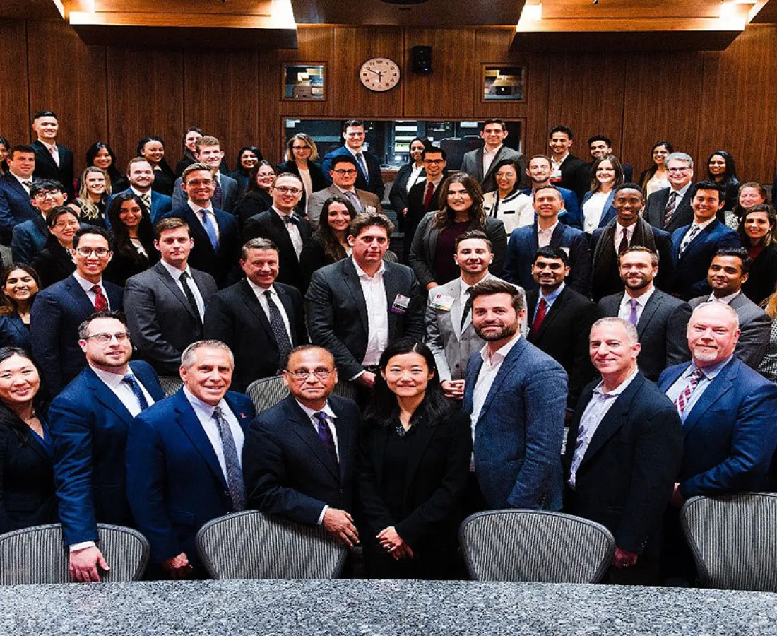 Participants from the 2019 case competition pose for overhead shot