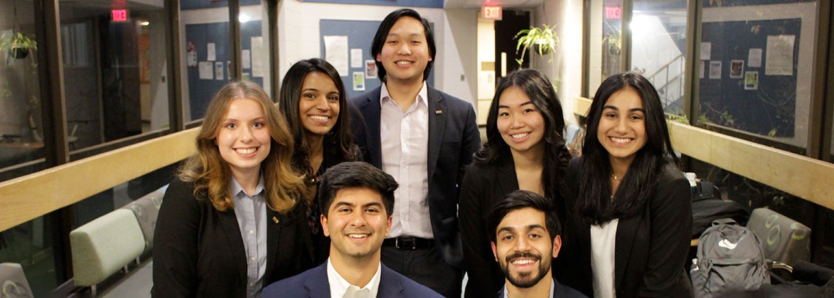 Phi Chi Theta members pose together for a group photo