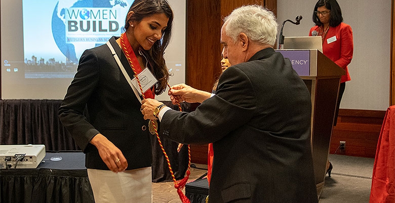 A student being honored at a Women Build ceremony