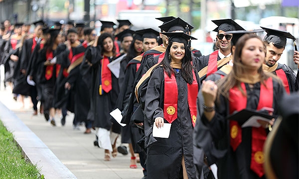 Graduates walking to the ceremony