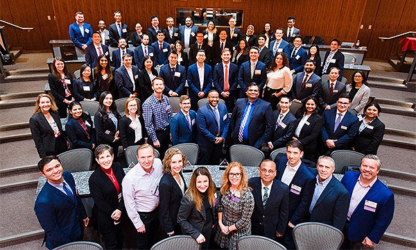 Participants from the 2018 case competition pose for overhead shot