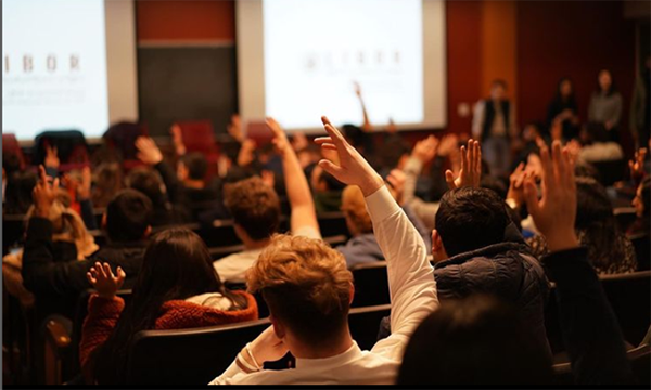 image of a student raising their hand at LIBOR event 