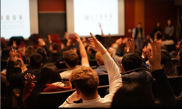 image of a student raising their hand at LIBOR event