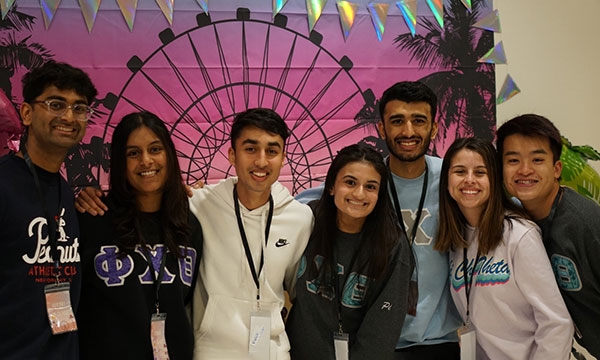 members posing at an event