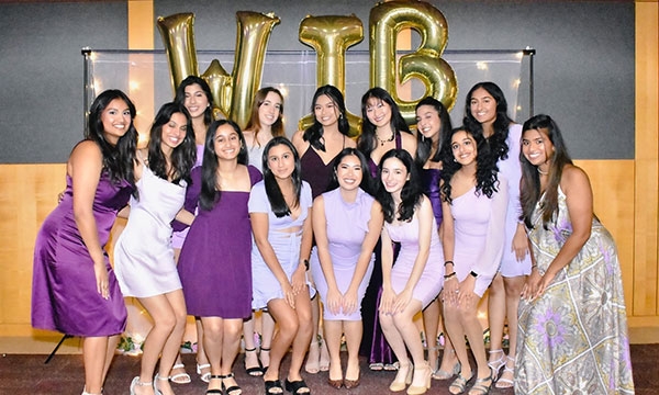members posing as a group