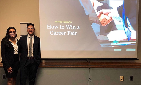 Two Ascend members give a presentation on How to Win a Career Fair.