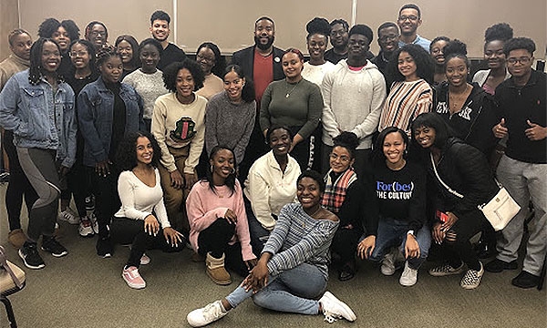 BBA members pose together in a classroom