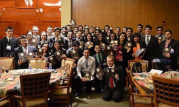 Members posing as a group at an event