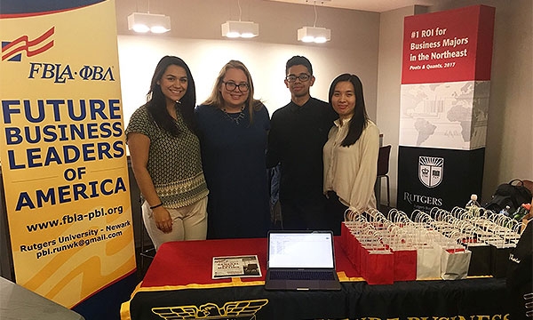 Members at a table at a group event