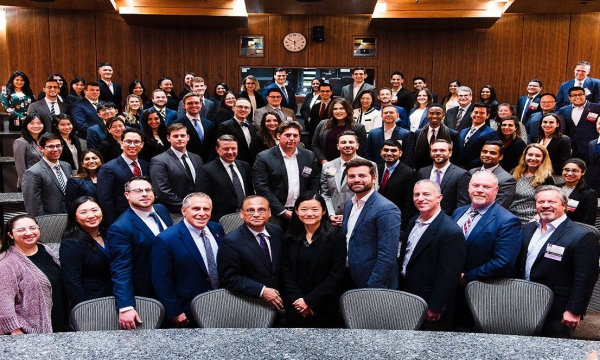 Participants from the 2019 case competition pose for overhead shot