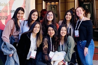 Members pose together outside the Fox Theatre