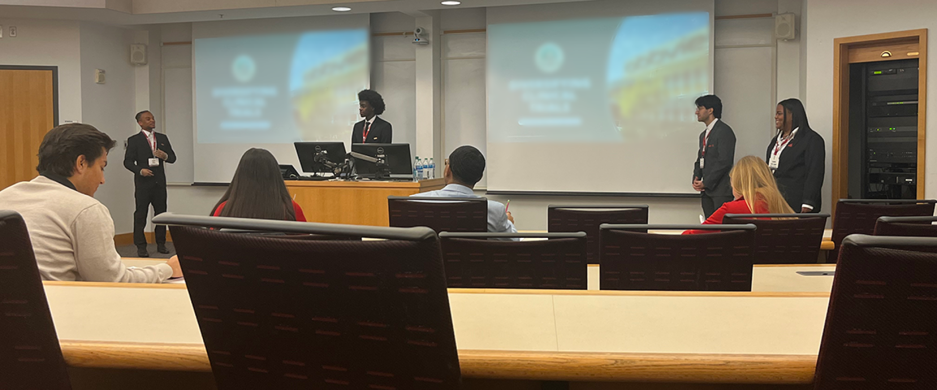 students presenting in a case competition