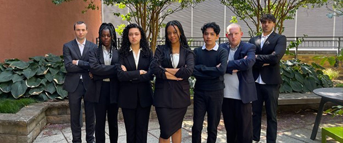 members posing as a group