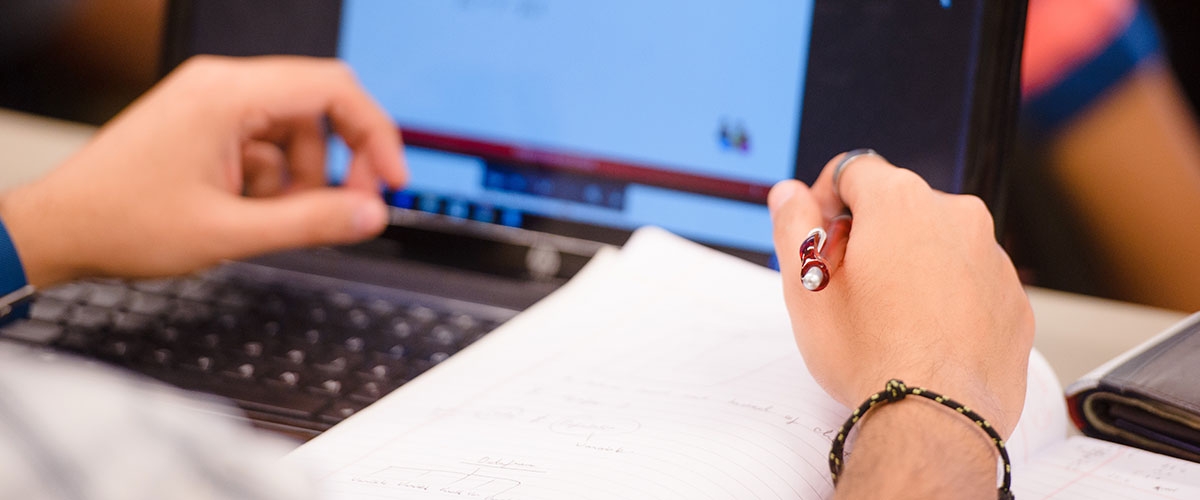 Student writing in class.