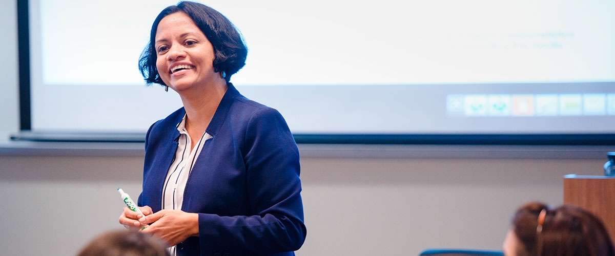 RBS professor Sonia Monga teaching.