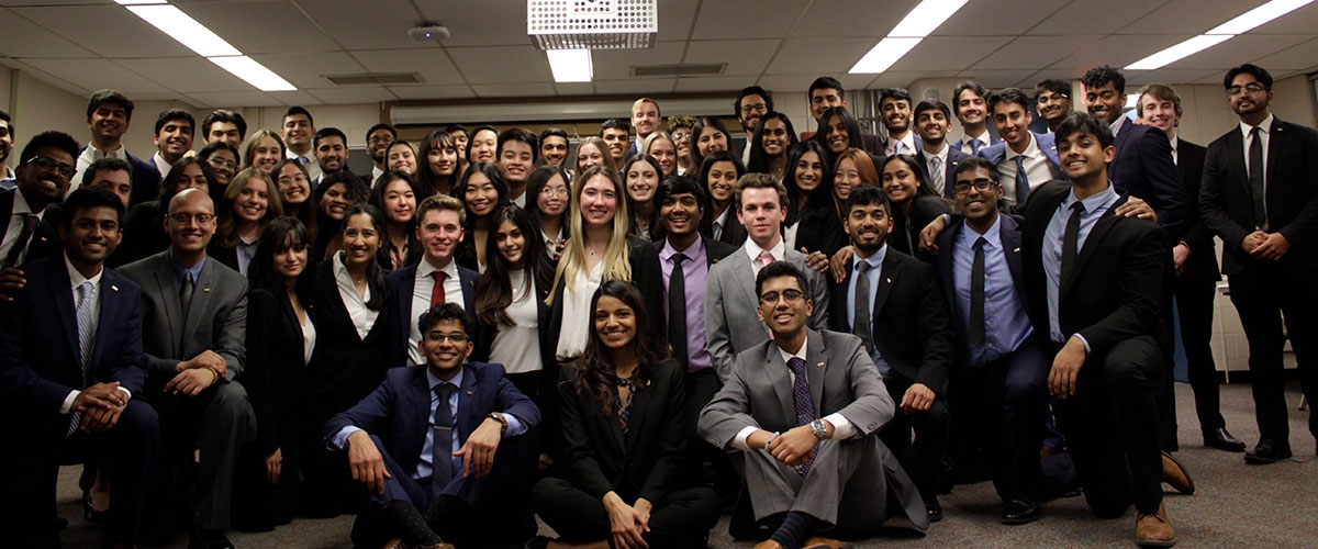 Phi Chi Theta members pose together for a group photo