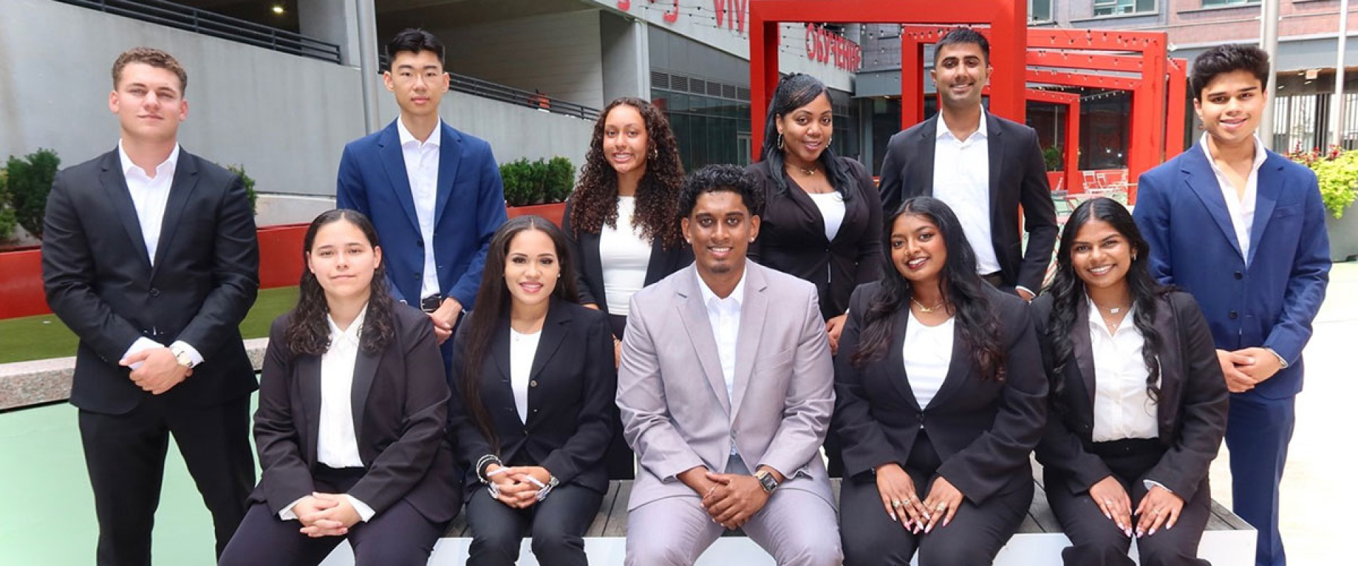 members posing as a group