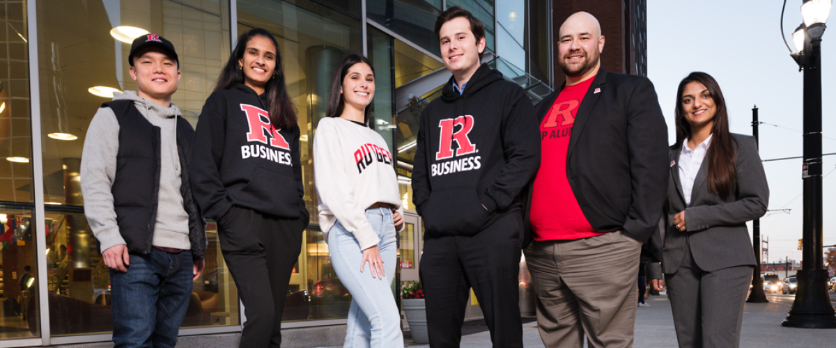 six students in rutgers attire in front of RBS