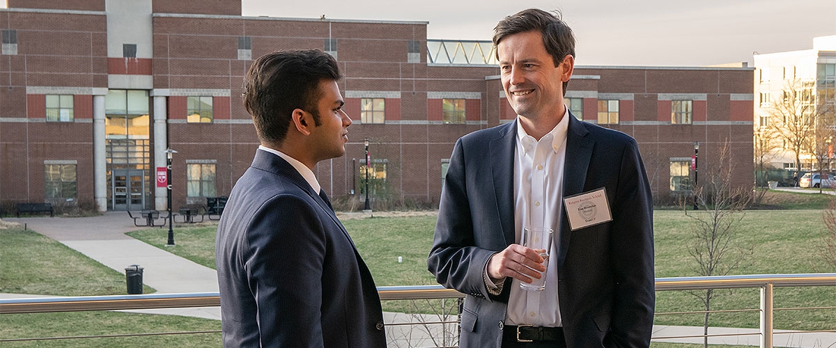 A student having a chat with his mentor