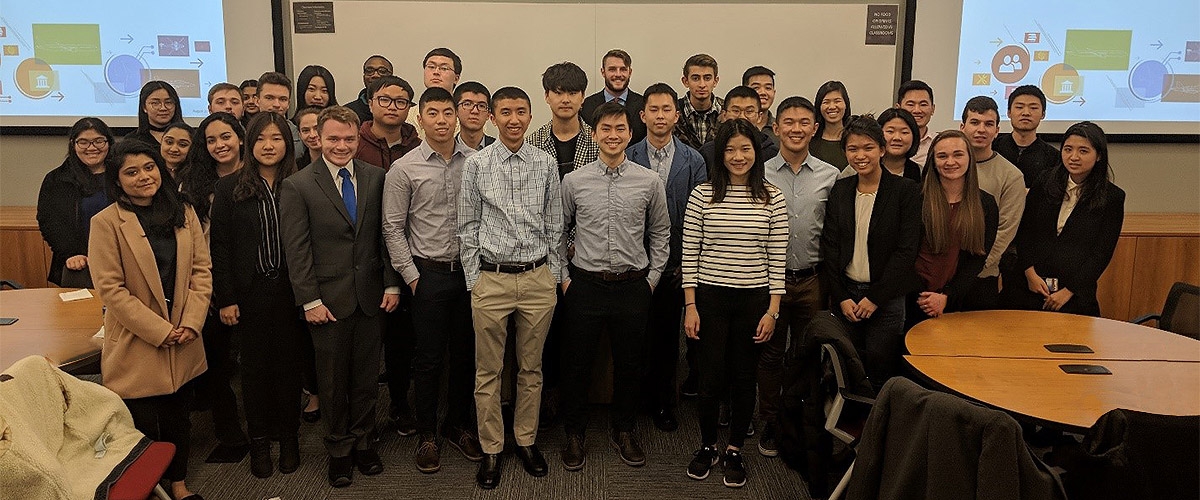 Members of the group pose for a group photo during a Boeing information session