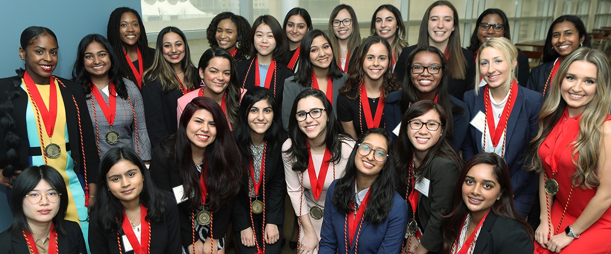 female students in the women build program smiling