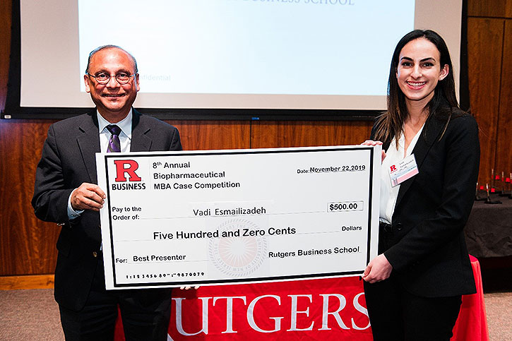 Winner from Johns Hopkins University holds a novelty check