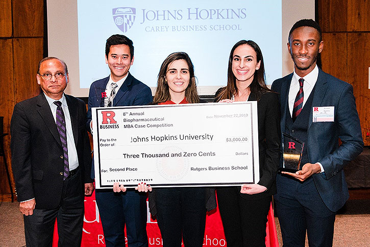 Team from Johns Hopkins University holding novelty check