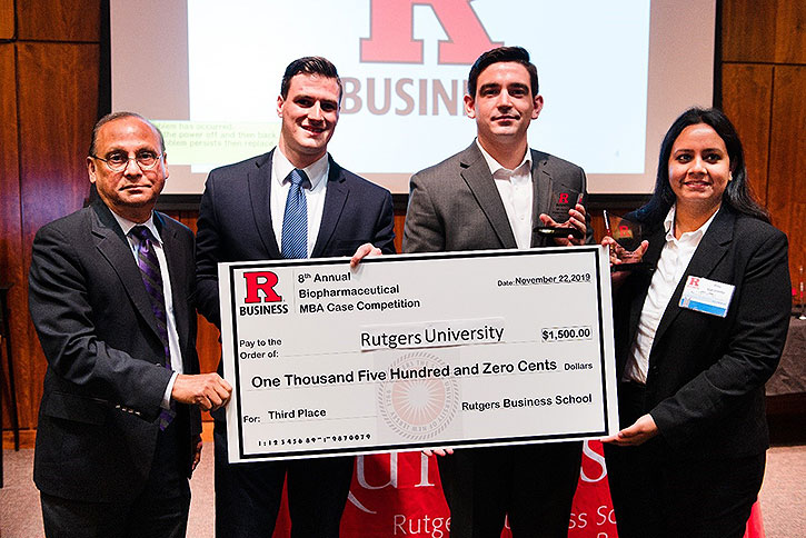 Rutgers University team holding a novelty check